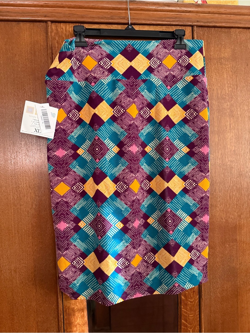 LuLaRoe Cassie skirt. Patterned Geometric Pencil Skirt in Teal, Purple & Yellow